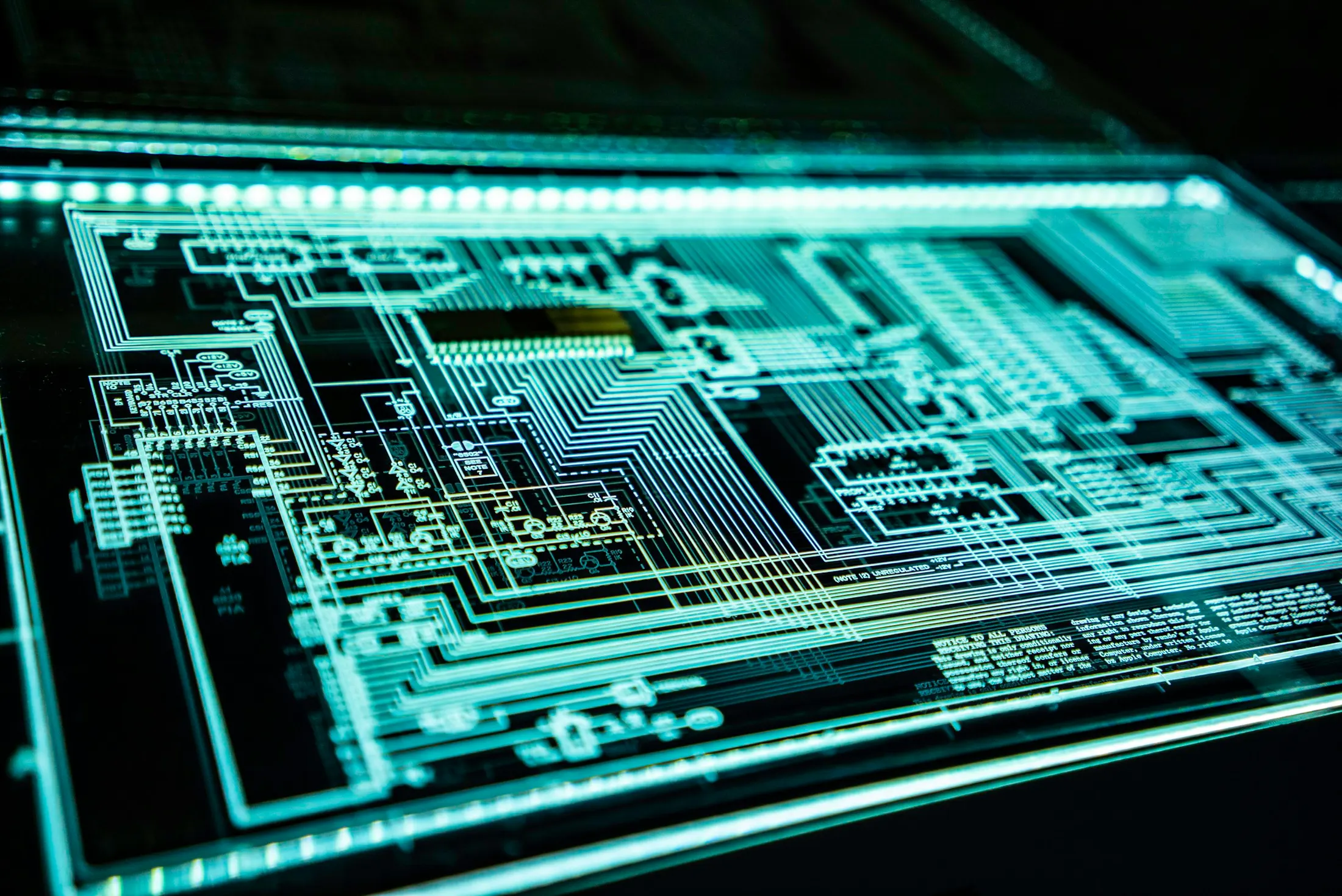 Illuminated circuit board representing software architecture and technical foundations