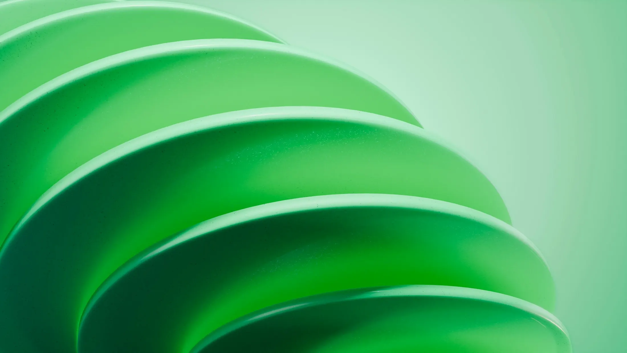 Abstract layered green form representing mobile-first product design